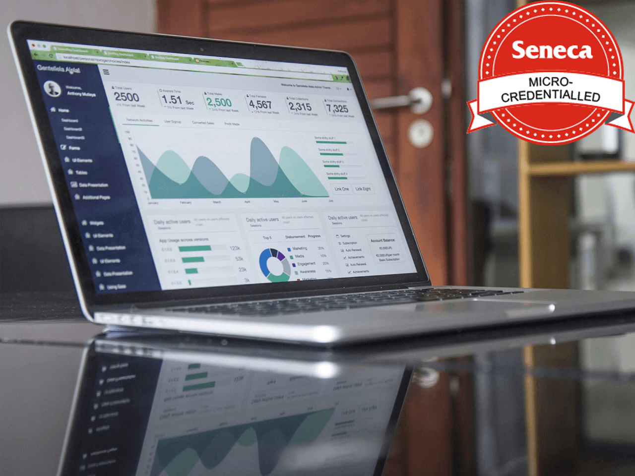 Photograph of laptop computer showing a graph with a red and white Seneca Micro-Credentialled badge superimposed