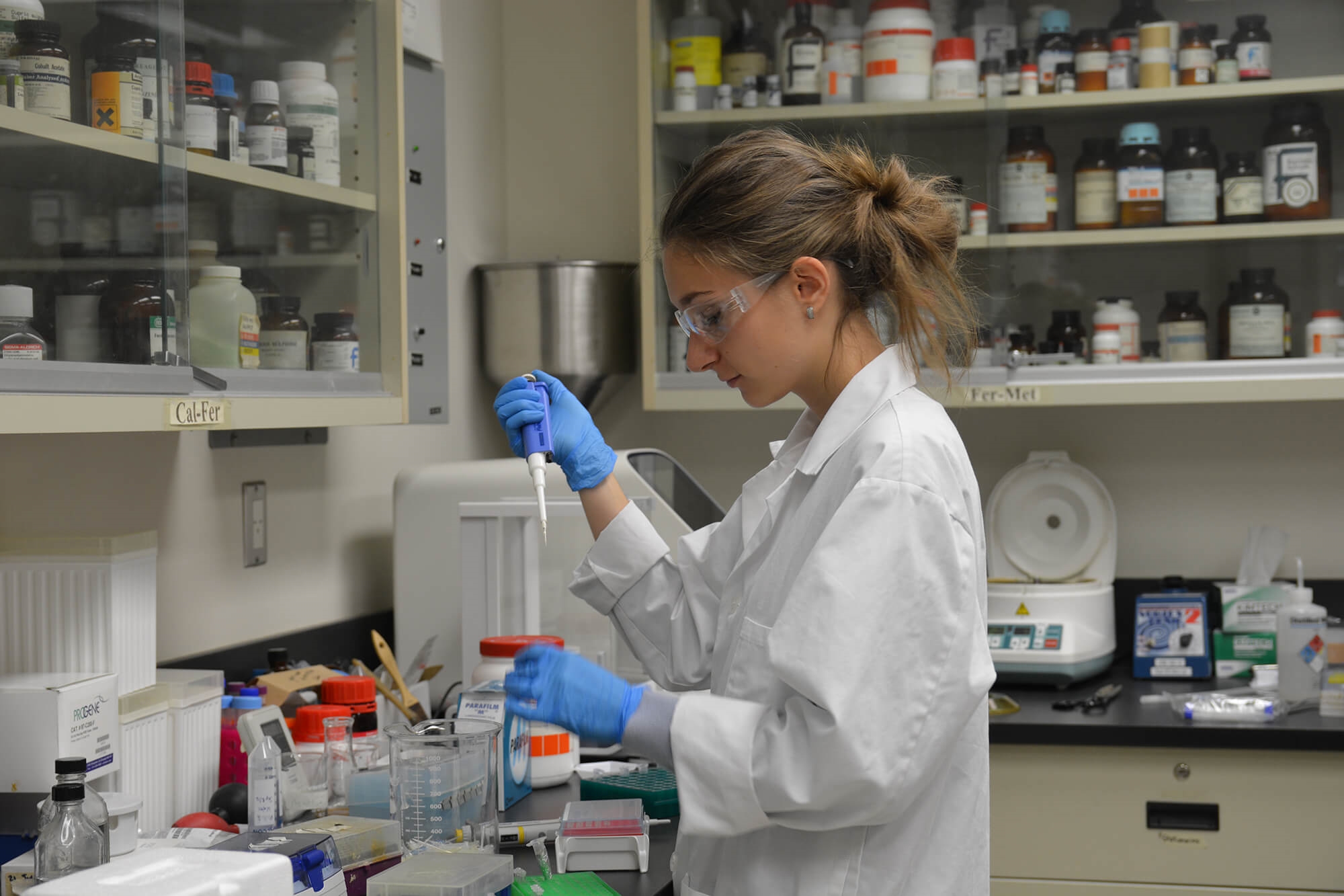 An applied research student working in a laboratory