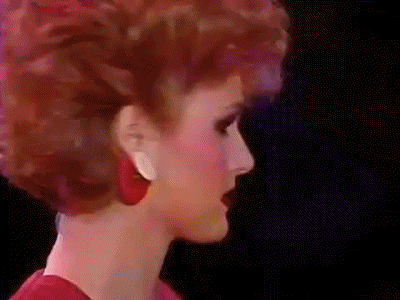 a GIF of supermodels turning their heads
