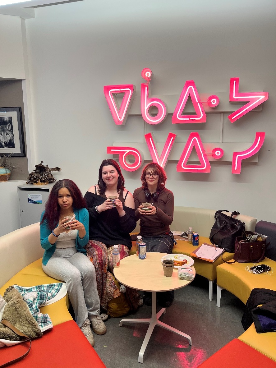 A group of women sitting at a tableDescription automatically generated