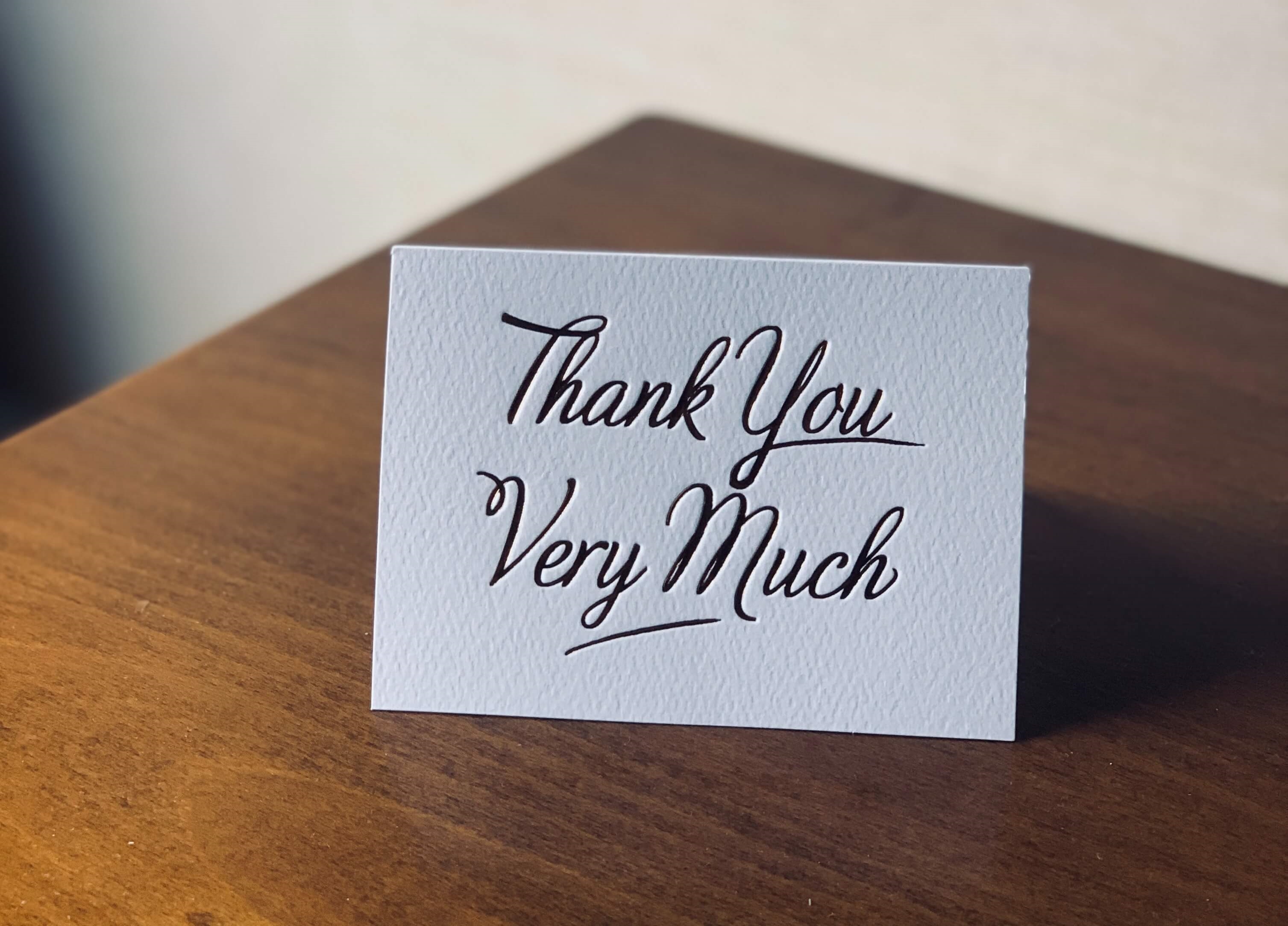 A handwritten note card that says "Thank you very much"