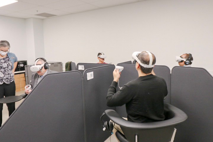 participants in the VR session wearing VR headsets