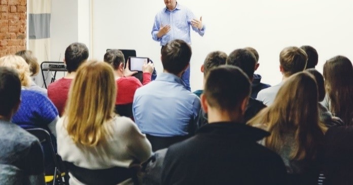 Image of group of adults sitting in the classroom