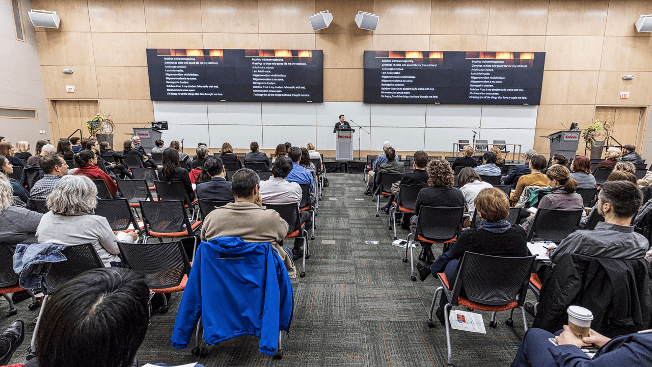 a picture from the keynote session at a past Teaching & Learning Day; all attendees are watching the keynote speaker